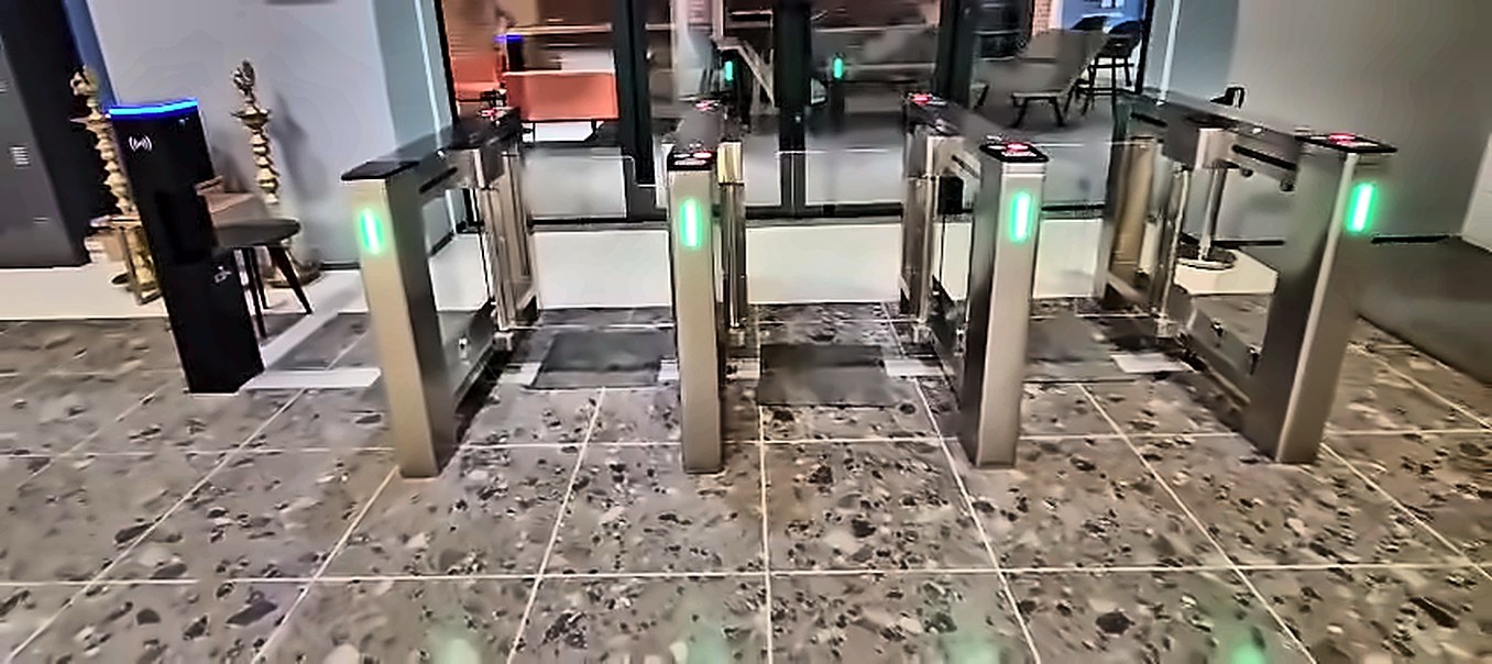 Four lanes of swing barrier speed gates in an office lobby